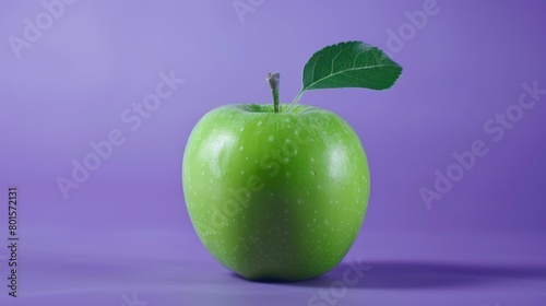 Fresh ripe green apple in purple background.
