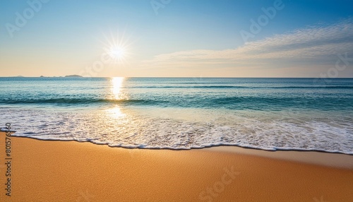 beautiful sunrise on beach ocean scene with blue water and sandy texture sun rays on the water tranquil relaxing travel vacation