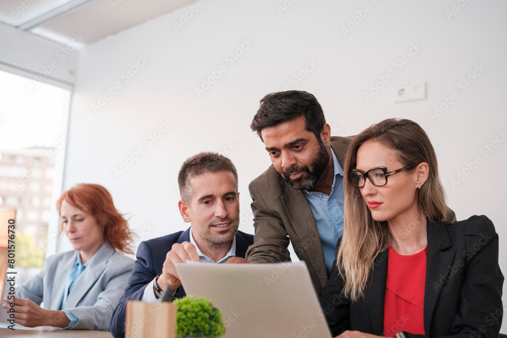 Company leader checking the work of his colleagues. Concept: business, leader, entrepreneur Company leader checking the work of his colleagues. Concept: business, leader, entrepreneur
