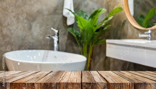 wooden table top and defocused bathroom sink counter as background