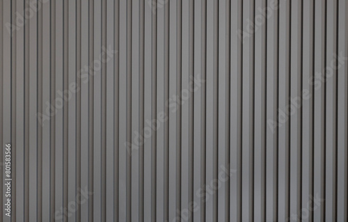Grey wall panel. Seamless background texture of grey painted wood paneling, metal siding, ribbed background textures.