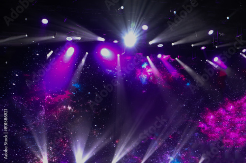 Concert background made of spotlights and multi-colored artificial light