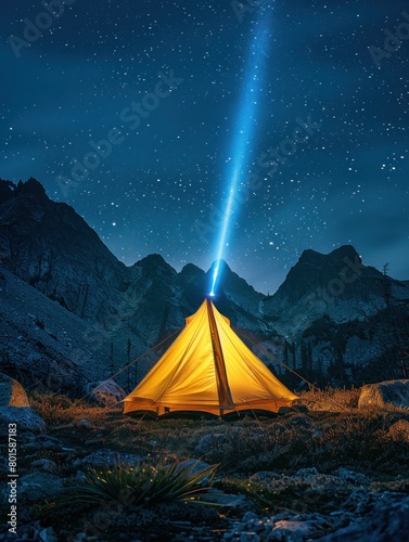 A yellow tent is lit up by a blue light in the middle of a mountain range. The scene is peaceful and serene, with the stars shining brightly in the sky