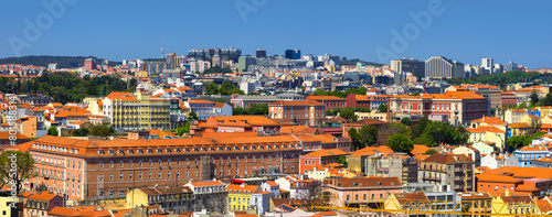 Panoramic view of Lisbon cityscape, budlings with red roofs in Portugal.