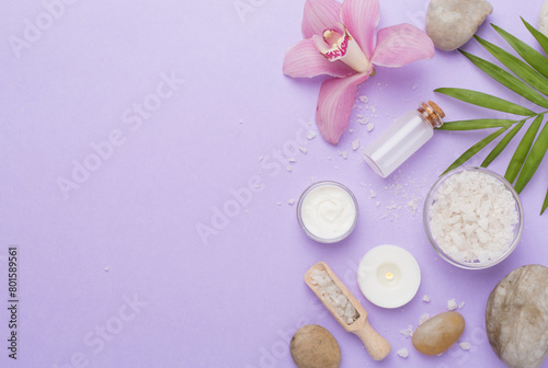 Composition with orchids  spa products on color background  top view