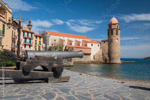 City old town of Collioure in France. Church and old cannon. Village next to Mediterranean sea. Tourism in the south of France.  photo