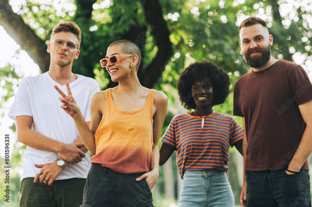 Obraz premium Interracial nature lovers posing and smiling at the camera.