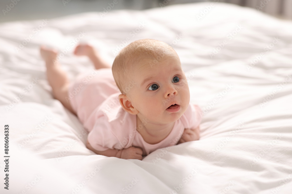 Cute little baby lying on white sheets Cute little baby lying on white sheets