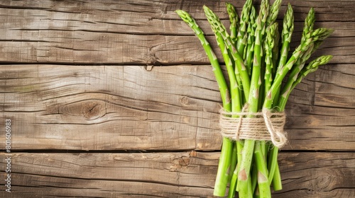 Top view bunch of fresh asparagus vegetable on rustic brown wooden table. AI generated image