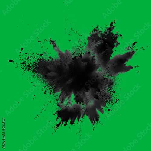 Dynamic explosion of black powder against green screen chromakey background © LiliGraphie