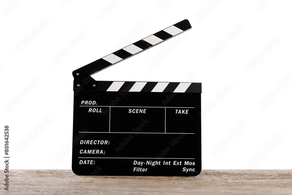 Obraz premium Movie clapper on wooden table against white background