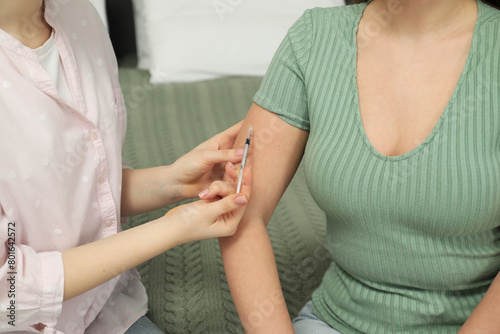Diabetes. Woman getting insulin injection indoors, closeup