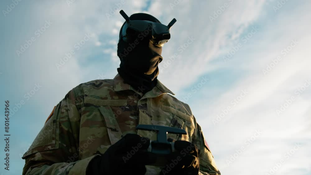 Man In Military Uniform With VR Headset Pilots A Drone Outdoors To Missiles