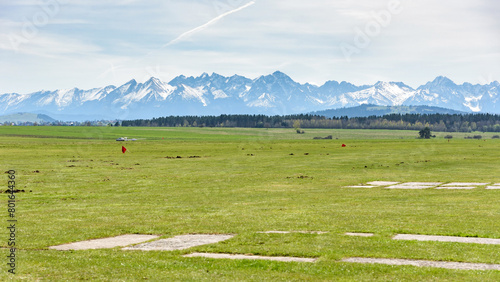 View of Tatra mountains from sport grass airfield in Nowy Targ