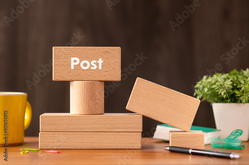 There is wood block with the word Post. It is as an eye-catching image.