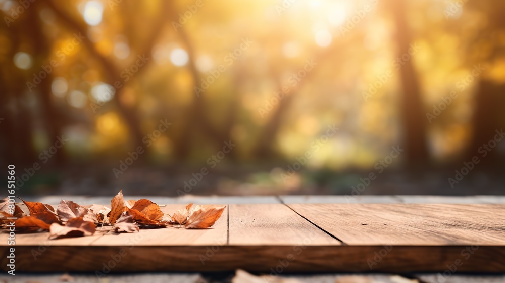 Wooden board presentation with blurred autumn background Wooden board presentation with blurred autumn background