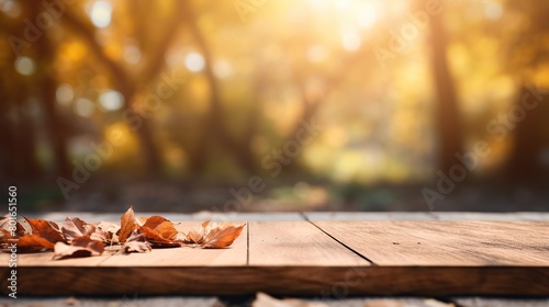 Wooden board presentation with blurred autumn background
