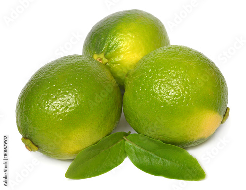 Three lime fruit whole with leaves isolated on white background