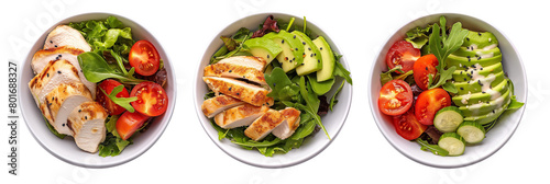 Healthy salad with chicken, avocado, cherry tomatoes and arugula isolated on a transparent background. Top view.