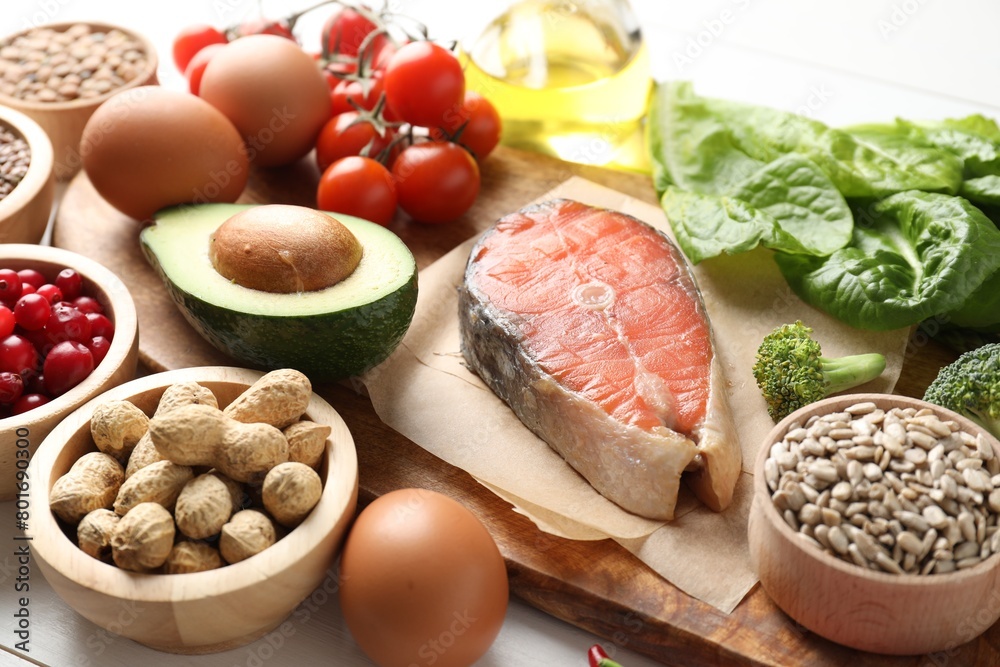 Many different healthy food on white table, closeup Many different healthy food on white table, closeup