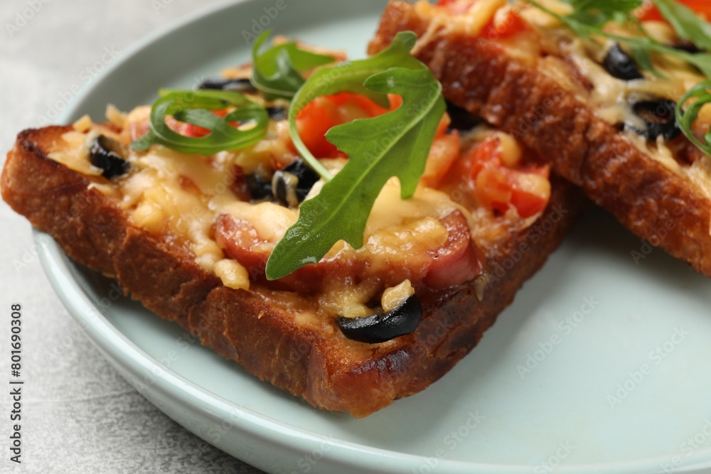 Tasty pizza toasts served on grey table, closeup Tasty pizza toasts served on grey table, closeup