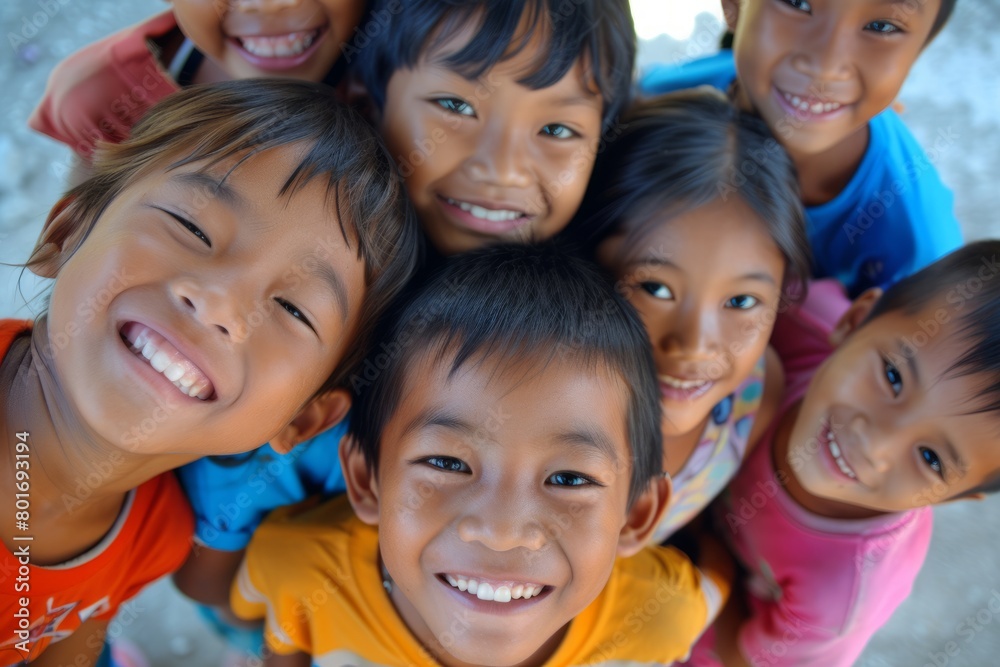 Group of asian children smiling and looking at the camera with happiness