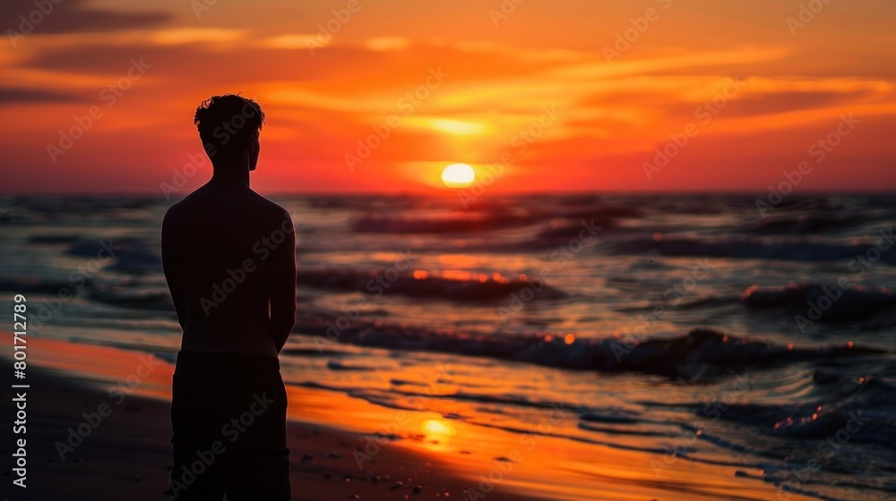 Contemplation at the beautiful sunset. Silhouette of the young man on the beach Ai generated