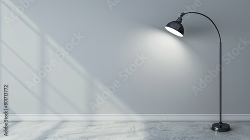 Light gray wall with a solitary industrial metal lamp photo