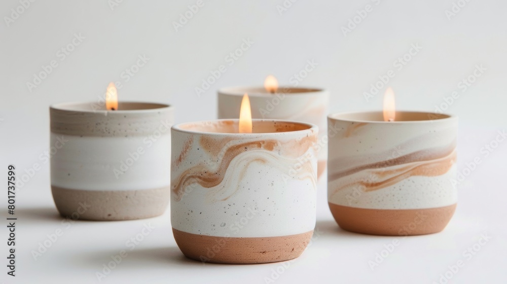 A set of handpoured candles in minimalist clay vessels each with a unique subtle marbling effect.. A set of handpoured candles in minimalist clay vessels each with a unique subtle marbling effect..
