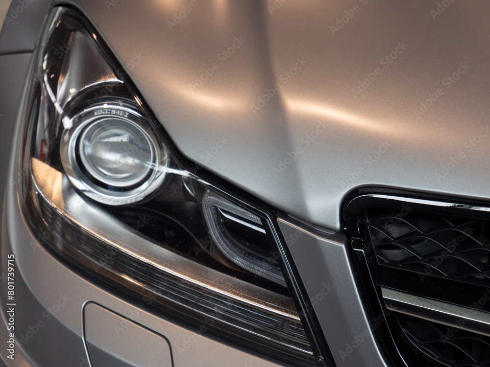 Close-up of Luxury Car Headlight and Grill