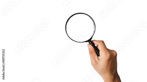 Hand holding magnifying glass