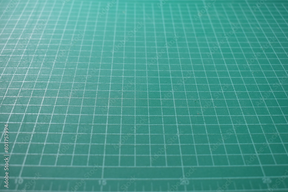green cutting mat board background with line and scale measure guide pattern for object art design, tool equipment of diy craft work green cutting mat board background with line and scale measure guide pattern for object art design, tool equipment of diy craft work