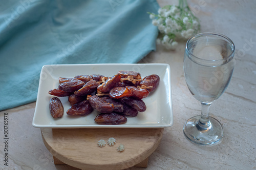 Dates and pure drinking water is consume to end Ramadan fast. Breaking Ramadan fast at Iftar. photo