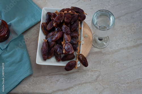 Dates and pure drinking water is consume to end Ramadan fast. Breaking Ramadan fast at Iftar. photo