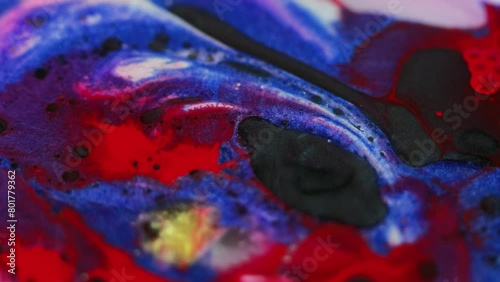 Paint blend. Ink mix. Defocused red black blue yellow pink color shimmering oil liquid dirty spots floating in sparkling glitter abstract art background. photo