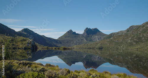 dove lake with glacier rock and cradle mt in the distance on a calm summer morning at cradle mountain national park