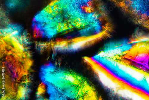 Brilliant, glowing grains of sand from California under the microscope.