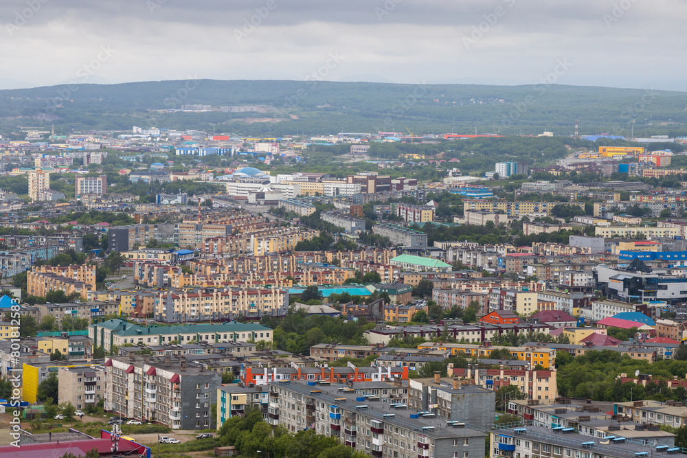 Top view of the cityscape. Residential urban areas. Aerial view of the buildings and streets of the city. Urban landscape. City of Petropavlovsk-Kamchatsky, Kamchatka Territory, Far East of Russia.
