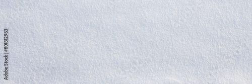 Obraz na płótnie Natural snow texture. Smooth surface of clean fresh snow. Snowy ground. Winter background with snow patterns. Closeup top view. Wide panoramic texture for background and design. w salonie