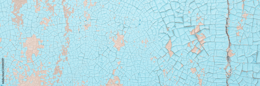 Peeling paint on the wall. Old concrete wall with cracked flaking paint. Weathered rough painted surface with patterns of cracks and peeling. High resolution texture for background and design. Closeup Peeling paint on the wall. Old concrete wall with cracked flaking paint. Weathered rough painted surface with patterns of cracks and peeling. High resolution texture for background and design. Closeup