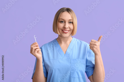 Smiling female dentist or n...