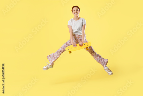 Young woman with skateboard...