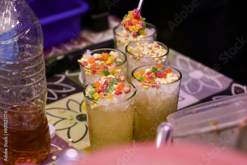 kulukki sarbath Calicut Kozhikode a cold refreshing summer drink. Popular Pineapple Limeade colourful cool drink in food street of Kozhikode Kerala beach roadside eateries.  photo