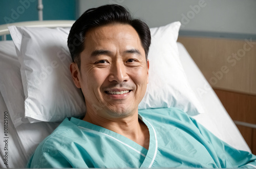 Male senior patient lying smile in hospital bed