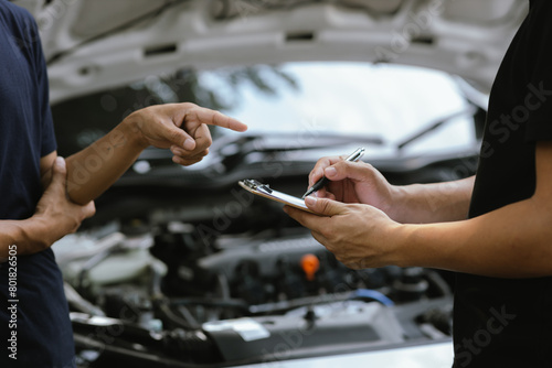 Mechanic checking engine Gather detailed information during work. Industrial plant maintenance services Until engine repair in factories, transportation, cars, vehicles