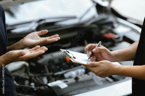 Mechanic checking engine Gather detailed information during work. Industrial plant maintenance services Until engine repair in factories  transportation  cars  vehicles