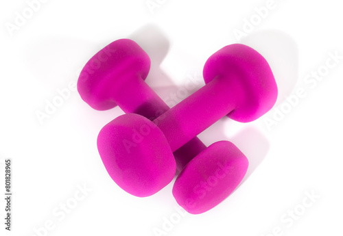 A pair of pink dumbbells for sports and fitness at the gym. Isolated in white bacground.