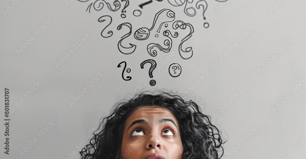 Woman thinking with question marks floating above her head on light ...