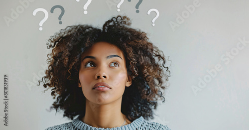 Woman thinking with question marks floating above her head on light grey background, banner design
