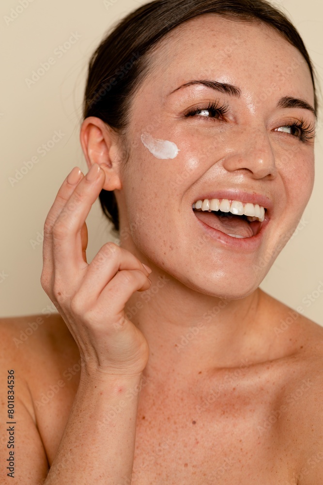 Moisturizing face cream on skin Moisturizing face cream on skin